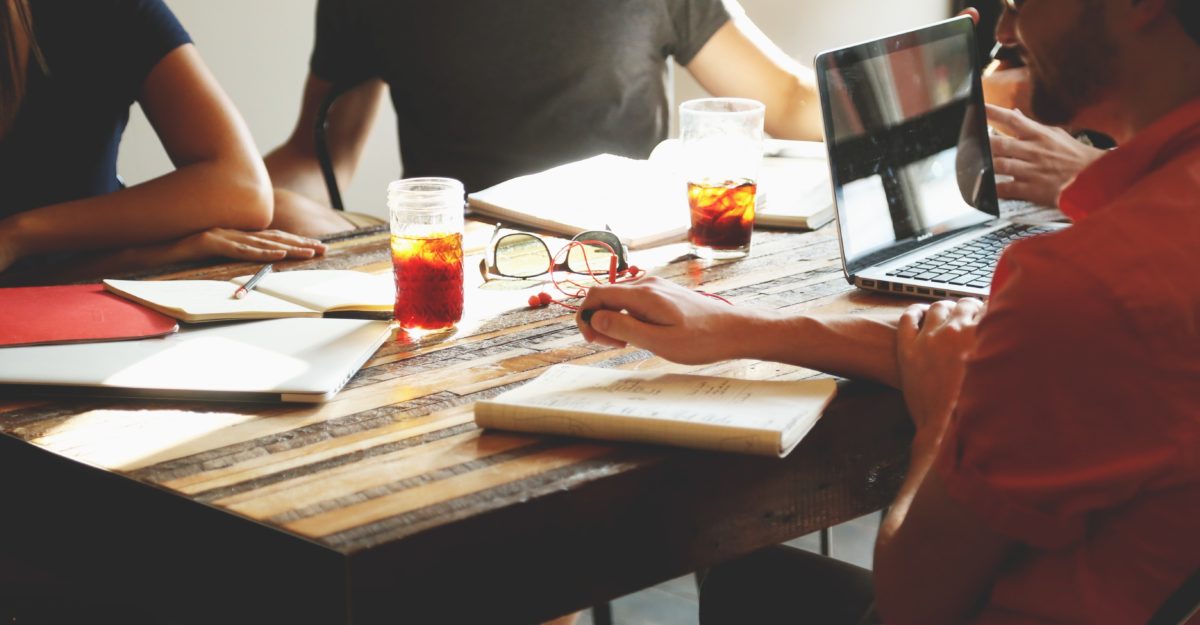 Group of people meeting at a table, sexual harassment at work