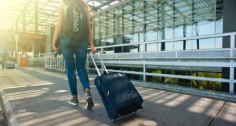 Woman with Luggage travel insurance