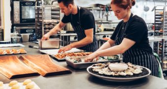 Kitchen Staff Prepare Catering Platters