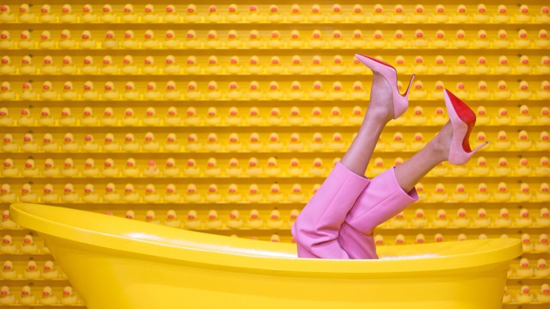 Legs Sticking Out of Yellow Bathtub