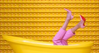 Legs Sticking Out of Yellow Bathtub