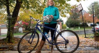 Woman Standing with Bicycle