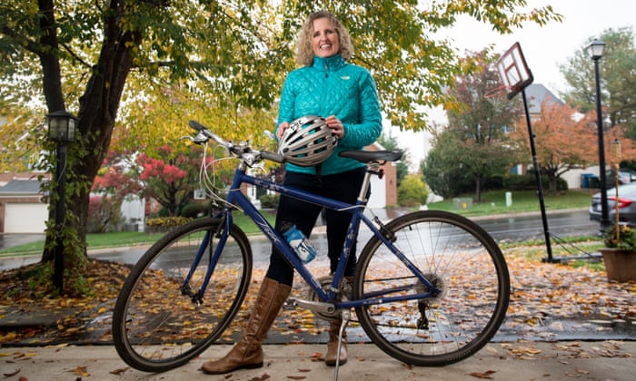 Woman Standing with Bicycle