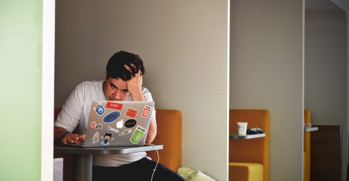 CEWS Stressed Worker at laptop
