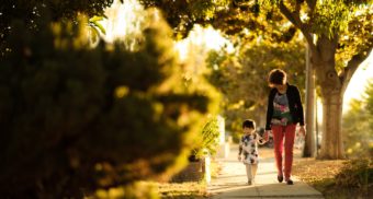 parents and child walking