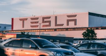 Tesla sued, tesla lawsuit, mass layoff