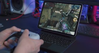 Someone uses a controller to play a video game. CD Projekt RED owes severance pay to employees who lose their job.