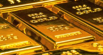 Multiple bars of gold placed side by side. Kinross Gold is a Canadian gold-producer