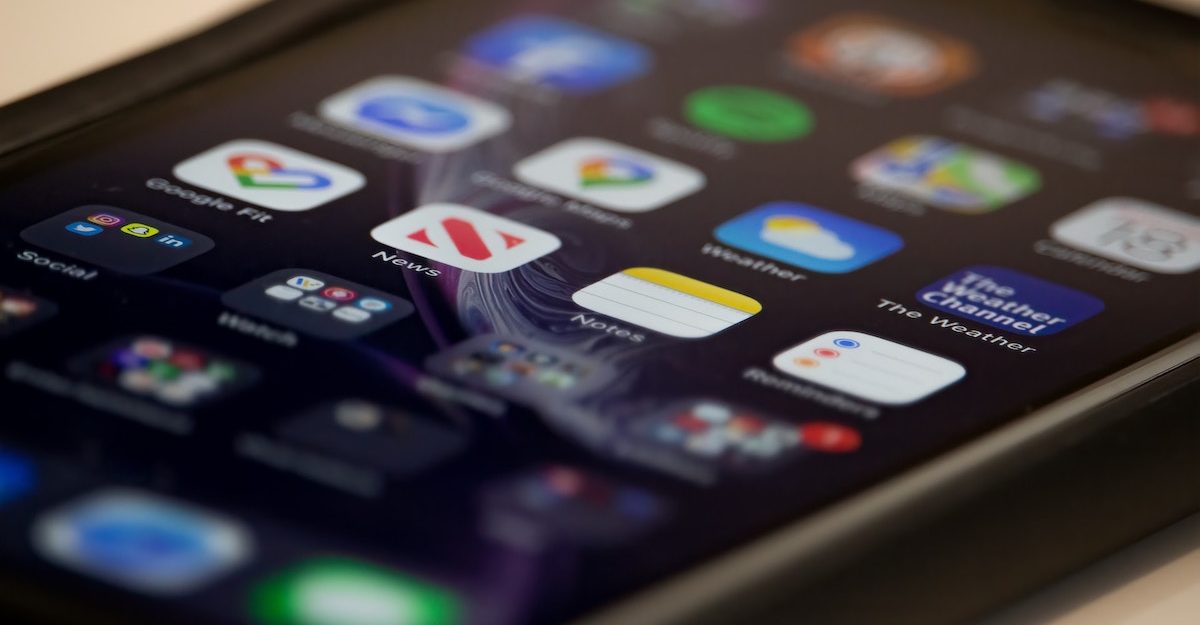 Dozens of apps are displayed on a smartphone screen. TikTok employees are entitled to severance pay when they lose their job.