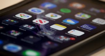 Dozens of apps are displayed on a smartphone screen. TikTok employees are entitled to severance pay when they lose their job.