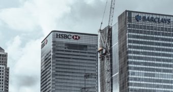 The Barclays and HSBC names are each displayed on separate, tall office towers.