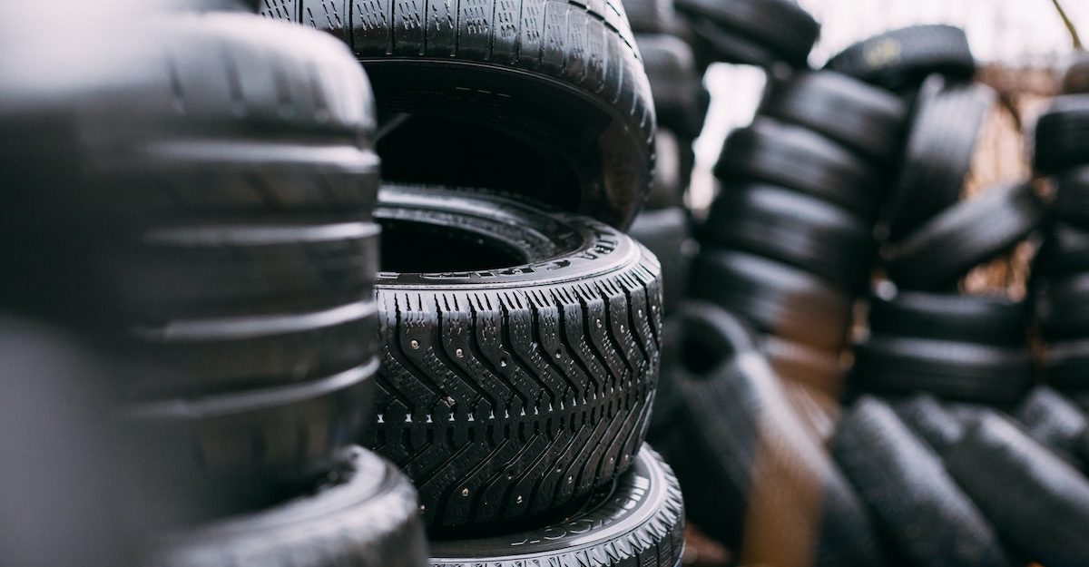 Numerous stacks of black tires. Fountain Tire employees are entitled to severance pay when they lose their job.