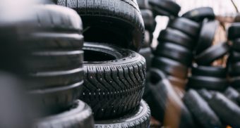 Numerous stacks of black tires. Fountain Tire employees are entitled to severance pay when they lose their job.