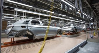 Unfinished car chassis on an automotive production line. Employees in the automotive industry are entitled to severance pay when they lose their job.