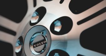 The volvo logo is shown on a wheel cover, surrounded by lug nuts.