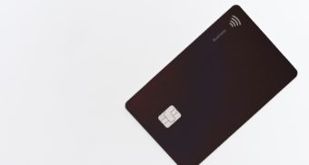 A black credit card, similar to an American Express Canada card.