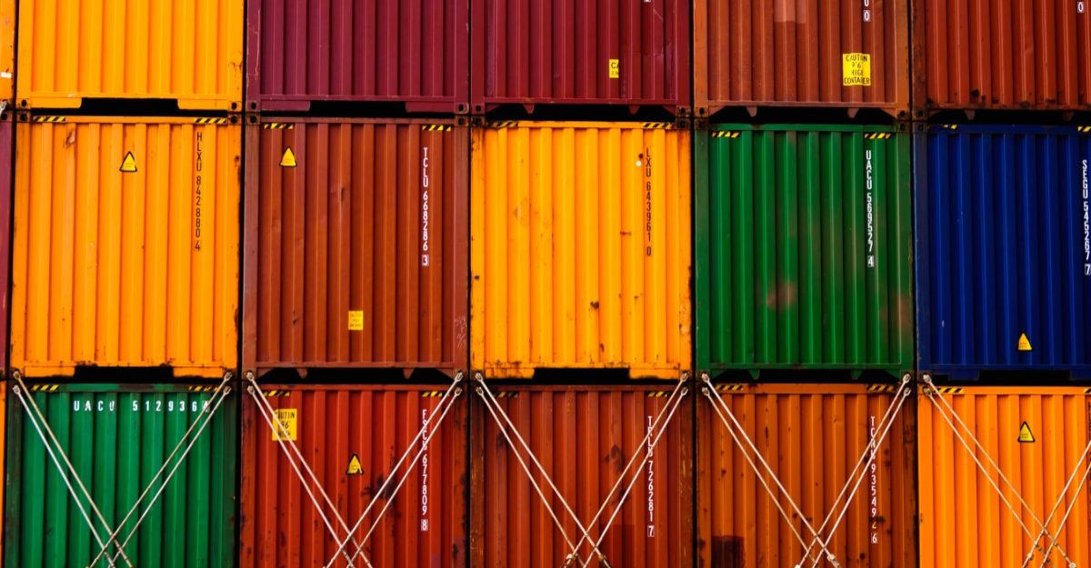 A photo of shipping containers in various colours. (Photo: Ishant Mishra / Unsplash)