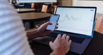 A photo of a person looking at a stock's performance. (Photo: Jason Briscoe / Unsplash)