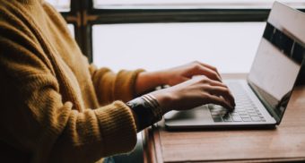 A photo of a person typing on a laptop. (Photo: Christin Hume / Unsplash)