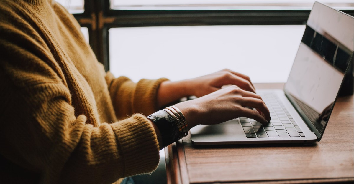 A photo of a person typing on a laptop. (Photo: Christin Hume / Unsplash)