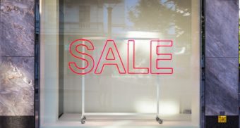 A store window advertises a sale during Boxing Day in Ontario.