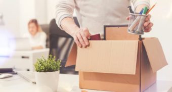 A photo of an employee clearing their desk after being let go. (Photo: Crunch Accounting / Google Images)