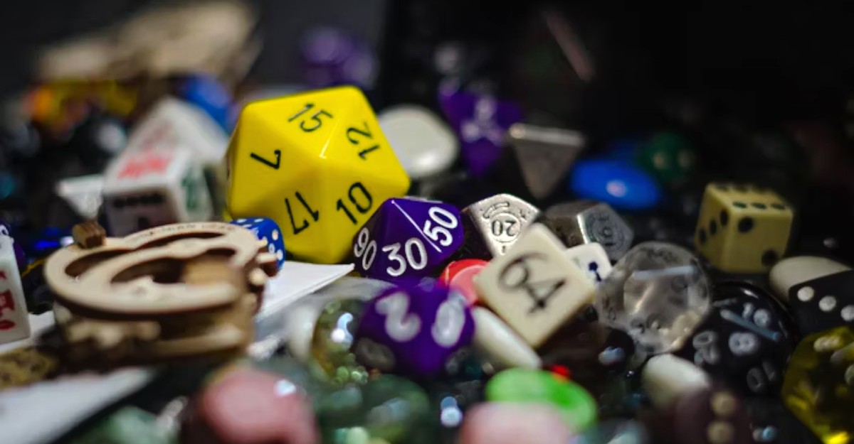 A photo of various types of dice on a table. (Photo: Nika Benedictova / Unsplash)