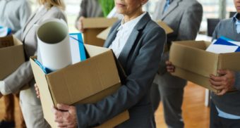 A photo of multiple people with cardboard boxes in their hands. (Photo: MarketWatch / Google Images)