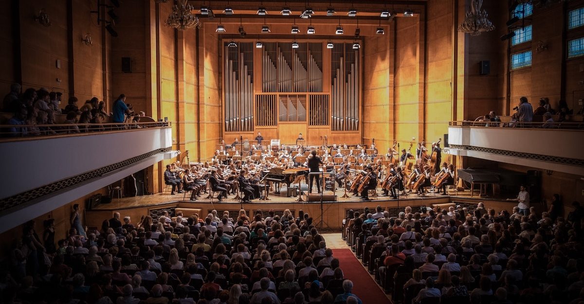 An orchestra performing in a concert hall, like the OSO led by Rosemary Thomson.