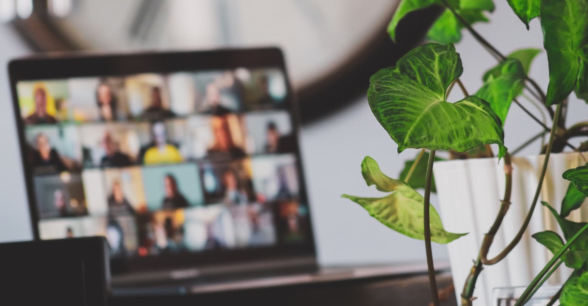 A photo of a laptop hosting a video conference call with staff members. (Photo: Sigmund / Unsplash)