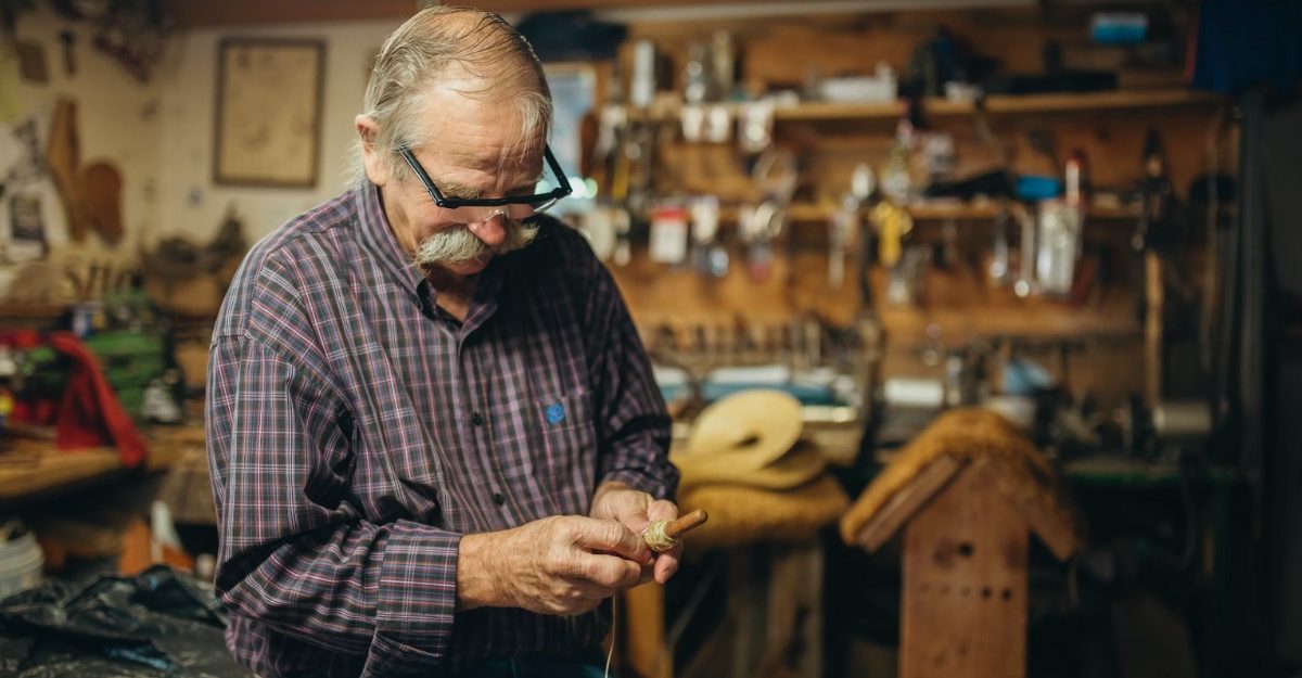 A photo of a person wrapping a thread around a wooden tool. (Photo: Carter Yocham / Unsplash)