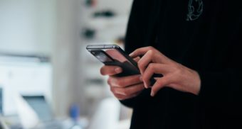 A photo of a person using a smartphone. (Photo: Jonas Leupe / Unsplash)