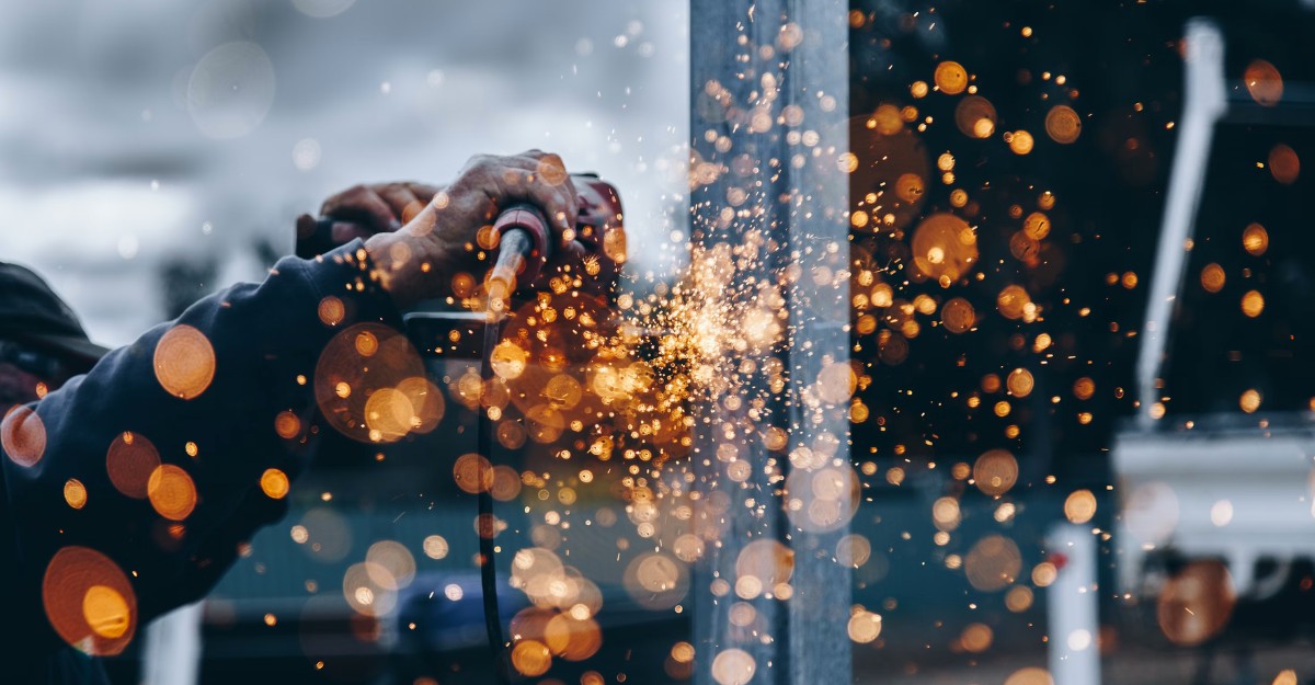 A photo of a person operating a piece of machinery. (Photo: Christopher Burns / Unsplash)