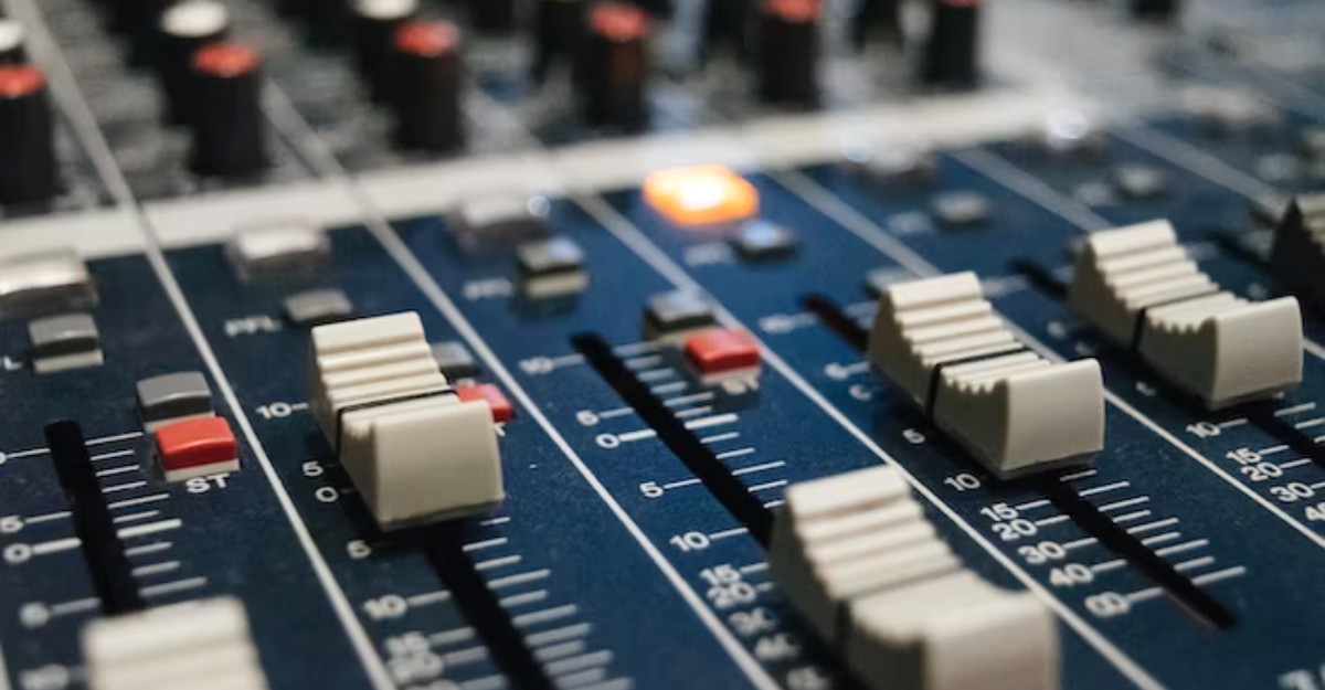 A close-up photo of a DJ mixer. (Photo: Alexey Ruban / Unsplash)