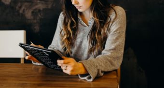 A photo of a person interacting with a tablet. (Photo: Brooke Cagle / Unsplash)