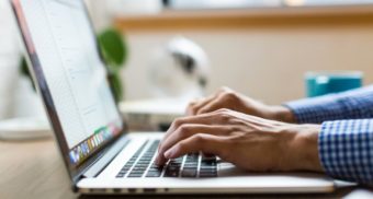 A photo of a person typing on a MacBook. (Photo: Burst / Unsplash)