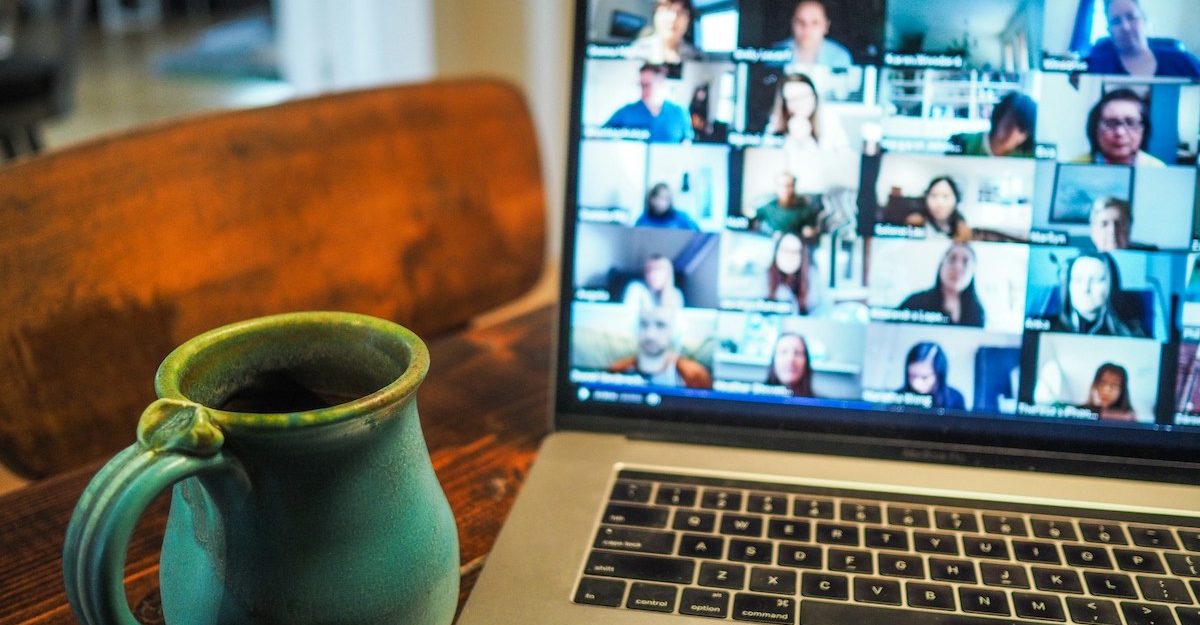 A remote worker in British Columbia attends a videoconference.