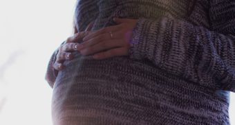 A pregnant woman taking EI maternity and parental benefits in Alberta.