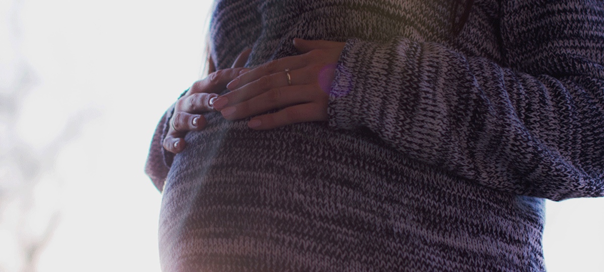 A pregnant woman taking EI maternity and parental benefits in Alberta.