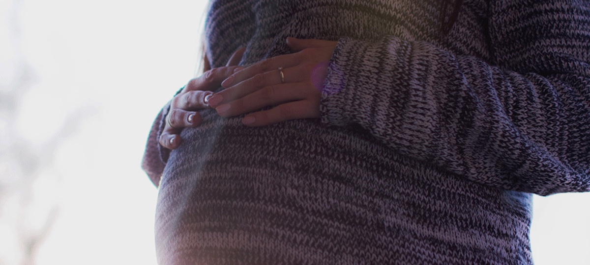 A pregnant woman taking EI maternity and parental benefits in Ontario.