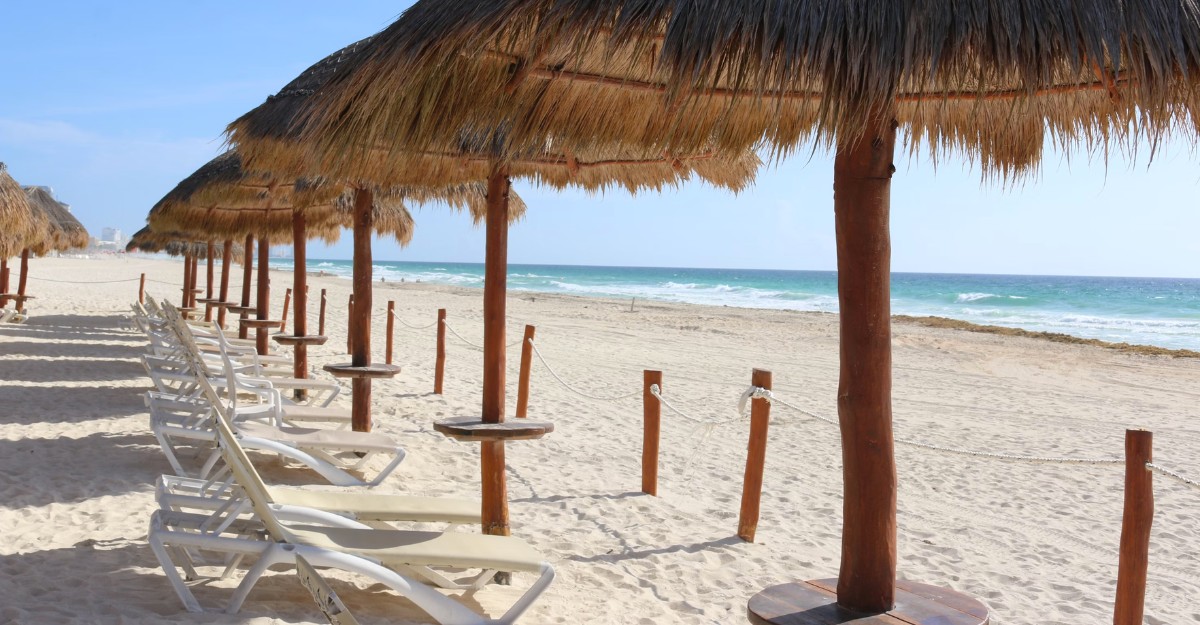 A photo of lounge chairs at a beach in Cancún, Mexico. (Photo: Alex Zakharchenko / Unsplash)