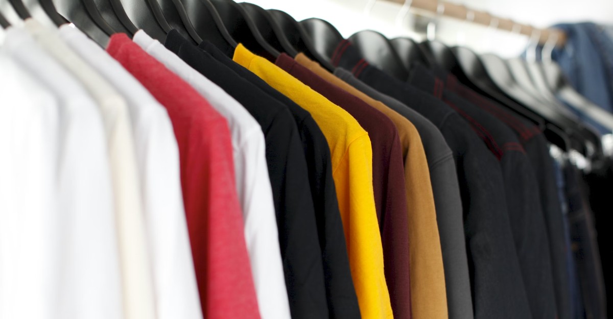 A photo of clothing on a rack. (Photo: Parker Burchfield / Unsplash)