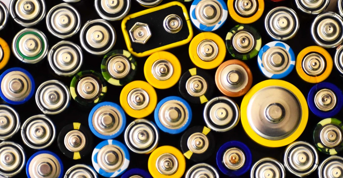 A photo of various batteries on a table. (Photo: Vardan Papikyan / Unsplash)