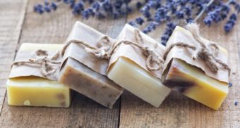 A photo of various soaps on a wooden table. (Photo: Aurélia Dubois / Unsplash)