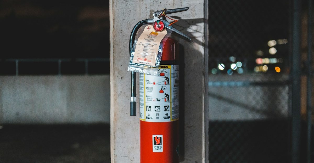 A fire extinguisher, like those provided by Classic Fire + Life Safety.