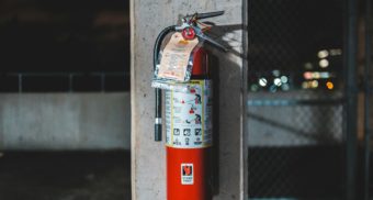 A fire extinguisher, like those provided by Classic Fire + Life Safety.