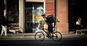 A photo of a person making a delivery on their bicycle. (Photo: Patrick Connor Klopf / Unsplash)