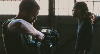 A photo of a person filming an actor with a camera. (Photo: Jakob Owens / Unsplash)