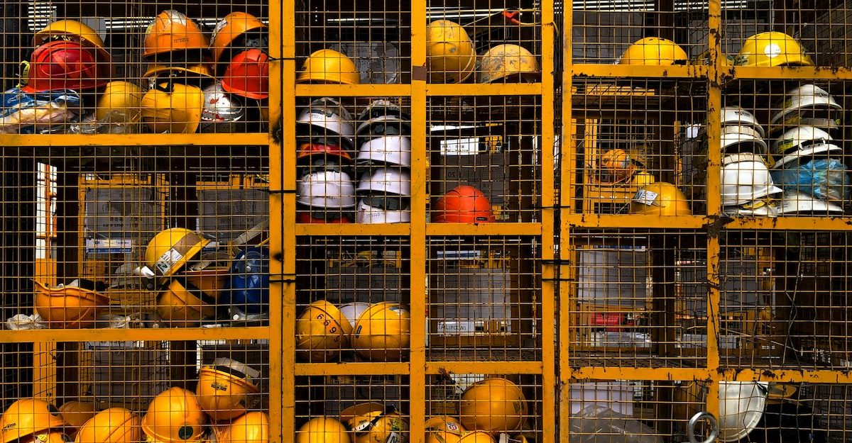 A collection of hard hats, similar to those likely used by ATCO employees.