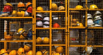 A collection of hard hats, similar to those likely used by ATCO employees.